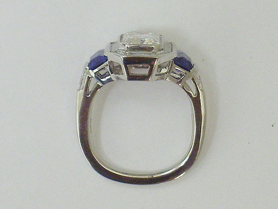 Platinum ring with Emerald cut diamond and bullet shaped Sapphires